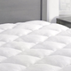 eLuxurySupply Mattress Pad with Fitted Skirt, $55-$73